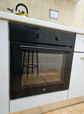 a black oven in a kitchen with a sink at Costantino Imperatore Apt in Rome