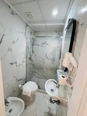 a bathroom with a toilet and a sink at Casa Roma in Rome