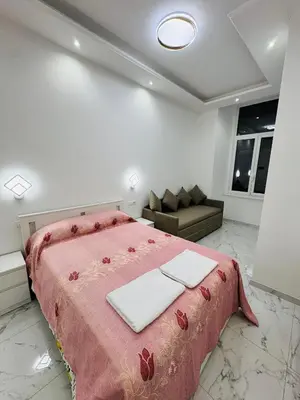 a bedroom with a large bed and a couch at Casa Roma in Rome