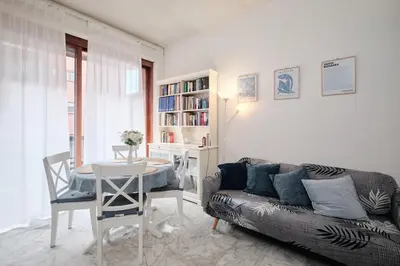 a living room with a couch and a table at Vaticano - Giubileo - A 2 passi da San Pietro by Hôtea in Rome