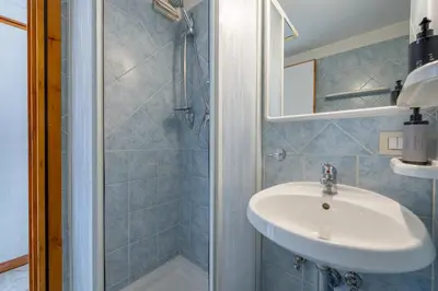 a bathroom with a sink and a shower at Panieri Apt - Homkeey Apartments in Rome