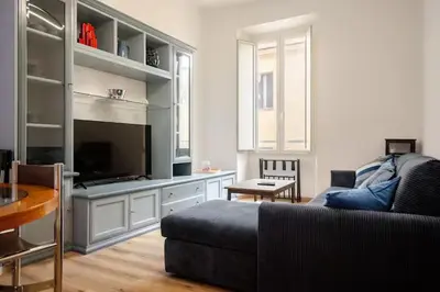 a living room with a couch and a television at RM 191 - La Tua Casa lontano da Casa in Rome