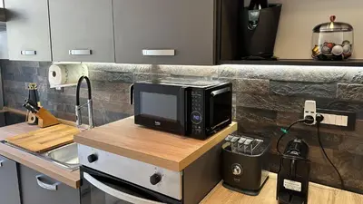 a microwave sitting on a counter in a kitchen at RM 191 - La Tua Casa lontano da Casa in Rome