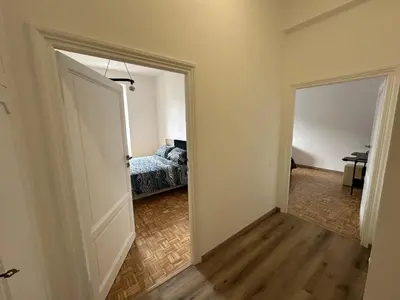 an empty room with a bed and a door to a bedroom at RM 191 - La Tua Casa lontano da Casa in Rome