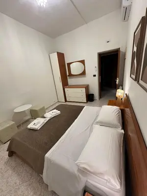 a bedroom with a large bed in a room at Alloggio Turistico Eli in Rome