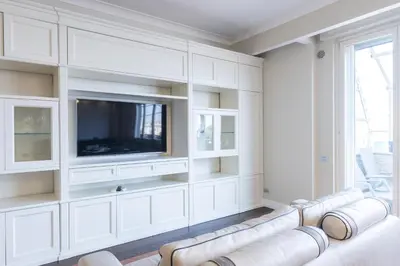 a living room with a couch and a flat screen tv at VIVILO COLLECTION - Magna Grecia 29 View Apartment in Rome
