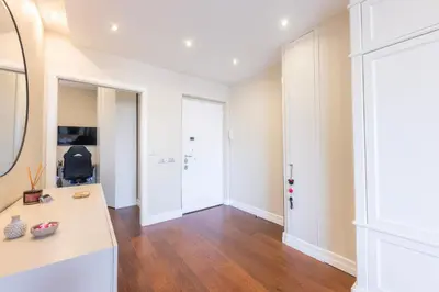 an empty room with a desk and a mirror at VIVILO COLLECTION - Magna Grecia 29 View Apartment in Rome