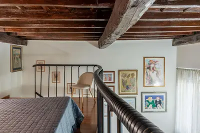 a bedroom with a bed and a wooden ceiling at GuestHost - Apartment Near Piazza Navona in Rome