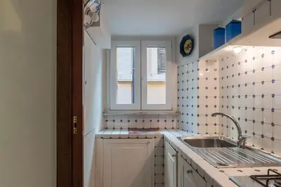 a small kitchen with a sink and a window at GuestHost - Apartment Near Piazza Navona in Rome