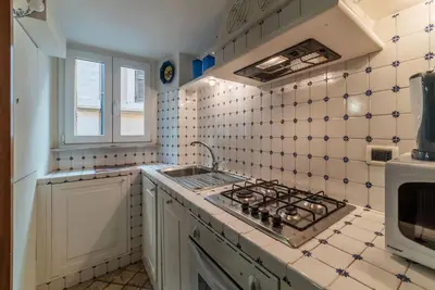 a kitchen with a sink and a stove at GuestHost - Apartment Near Piazza Navona in Rome