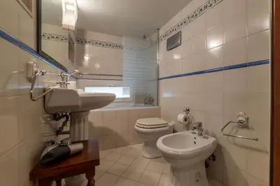 a bathroom with a toilet and a sink at GuestHost - Apartment Near Piazza Navona in Rome