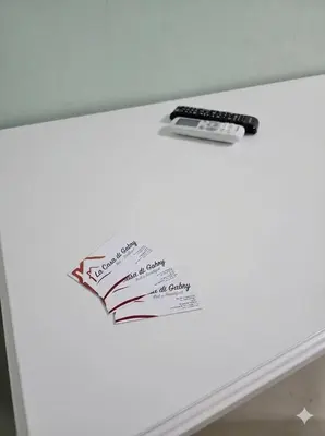 a note on top of a refrigerator with a remote control at B&B La Casa di Gabry in Rome