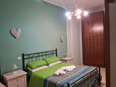 a bedroom with a bed with two towels on it at B&B La Casa di Gabry in Rome