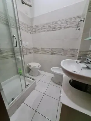 a bathroom with a toilet and a shower and a sink at B&B La Casa di Gabry in Rome