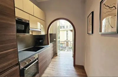 an archway in a kitchen with a stove top oven at Gallo 55 Stylish & Modern Stay Near the Vatican in Rome