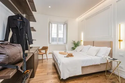 a bedroom with a large bed and a window at IV Leoni in Rome