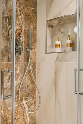 a shower with a glass door in a bathroom at IV Leoni in Rome