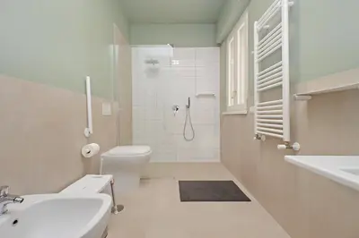 a bathroom with a toilet and a sink and a shower at Gioia's Flat in Rome