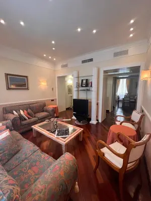 a living room with a couch and a coffee table at Residenza Lucullo in Rome