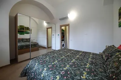 a bedroom with a large bed and a large mirror at Betterplace 2 in Rome