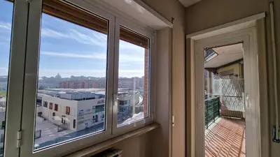 two windows in a room with a view of a city at Casa Vista San Pietro in Rome