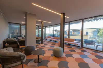 a lobby with couches and chairs in a building at AureaLiving - Sage luxury apt with Air Conditioning, Fast Wifi and free Gym in Rome