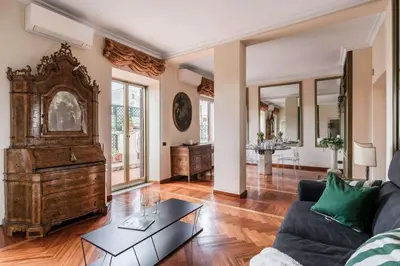a living room with a couch and a table at The Best Rent - One-bedroom apartment in a quiet, classically styled corner near the Quirinale in Rome
