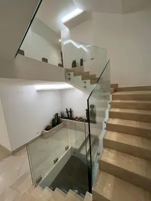 a room with a staircase with a glass case at GioLu Colosseo in Rome