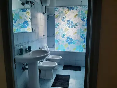 a bathroom with a sink and a toilet and a shower at Centro Metro Montitiburtini 510 in Rome
