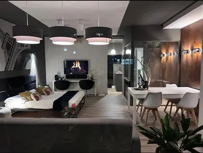 a living room with a bed and a dining room at Domus Angel's of Rome in Rome