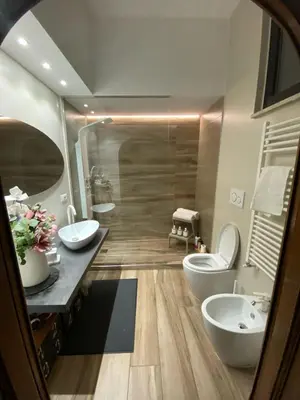 a bathroom with two sinks and two toilets at Domus Angel's of Rome in Rome