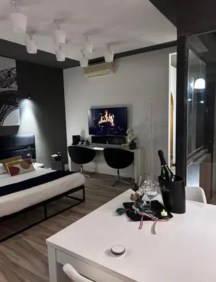 a living room with a couch and a tv at Domus Angel's of Rome in Rome
