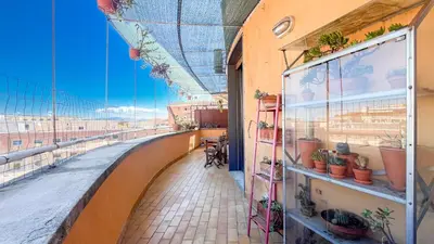 a building with a balcony with plants on it at La Casa di Livietta in Rome