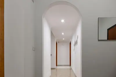 an archway in a hallway with white walls at La Dolce Vita in Rome