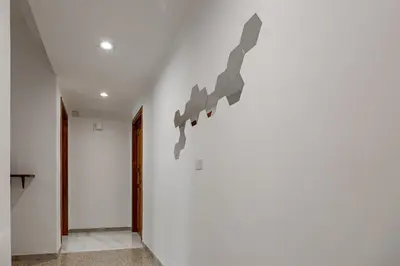 a hallway with a white wall with grey arrows on it at La Dolce Vita in Rome