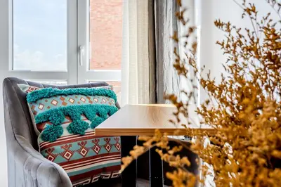 a living room with a couch and a table at Amor Rome Apartment & Suites in Rome
