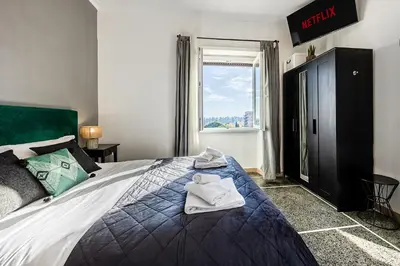 a bedroom with a bed with towels on it at Amor Rome Apartment & Suites in Rome