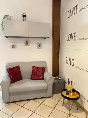 a living room with a couch and a table at Easy Suite Roma San Pietro in Rome