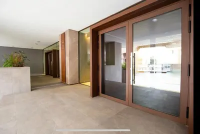 a hallway with sliding glass doors in a house at Stylish suite close by Trastevere and city life in Rome