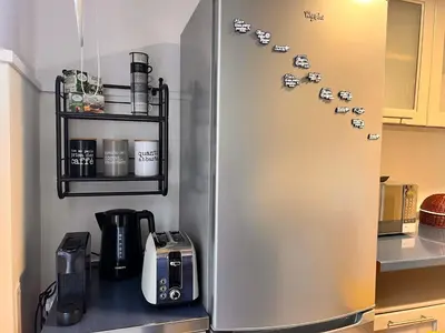 a refrigerator in a kitchen with magnets on it at San Giovanni tourist accommodation in Rome