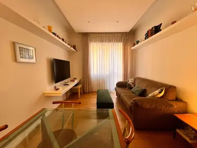 a living room with a couch and a glass table at San Giovanni tourist accommodation in Rome