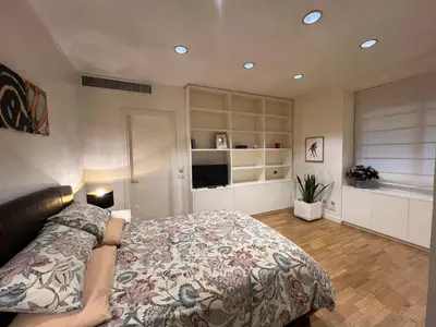 a bedroom with a bed and a television in it at Giulio Cesare APT in Rome