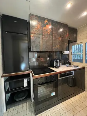 a kitchen with a sink and a stove top oven at Giulio Cesare APT in Rome