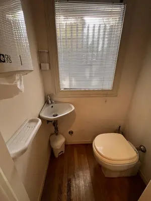 a bathroom with a toilet and a sink and a window at Giulio Cesare APT in Rome