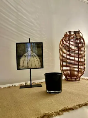 a television on a stand in a room with a lamp at Apartment in Rome-Trastevere - Amorhome in Rome