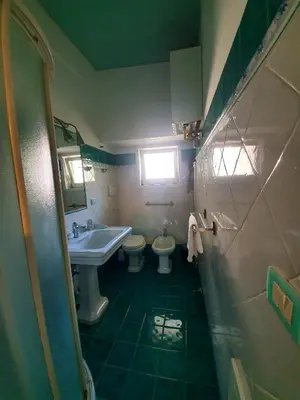a small bathroom with a sink and a toilet at Laterano Home in Rome