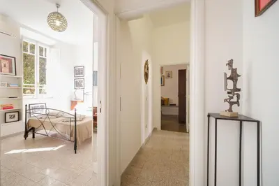 a hallway of a home with white walls at Vatican Domus by BuddyRent in Rome