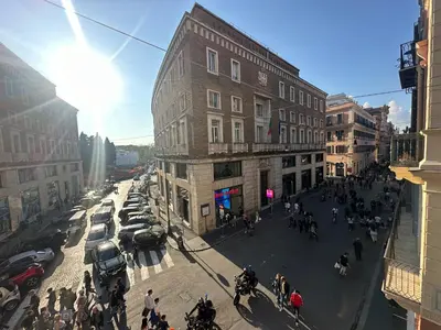 a group of people walking on a city street at Residenza Nobile Vittoria in Rome