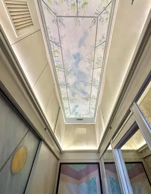 a coffered ceiling with a painting on the ceiling at Residenza Nobile Vittoria in Rome