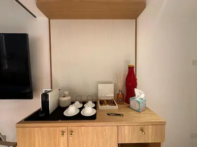 a wooden cabinet with three white porcelain objects on it at Residenza Nobile Vittoria in Rome